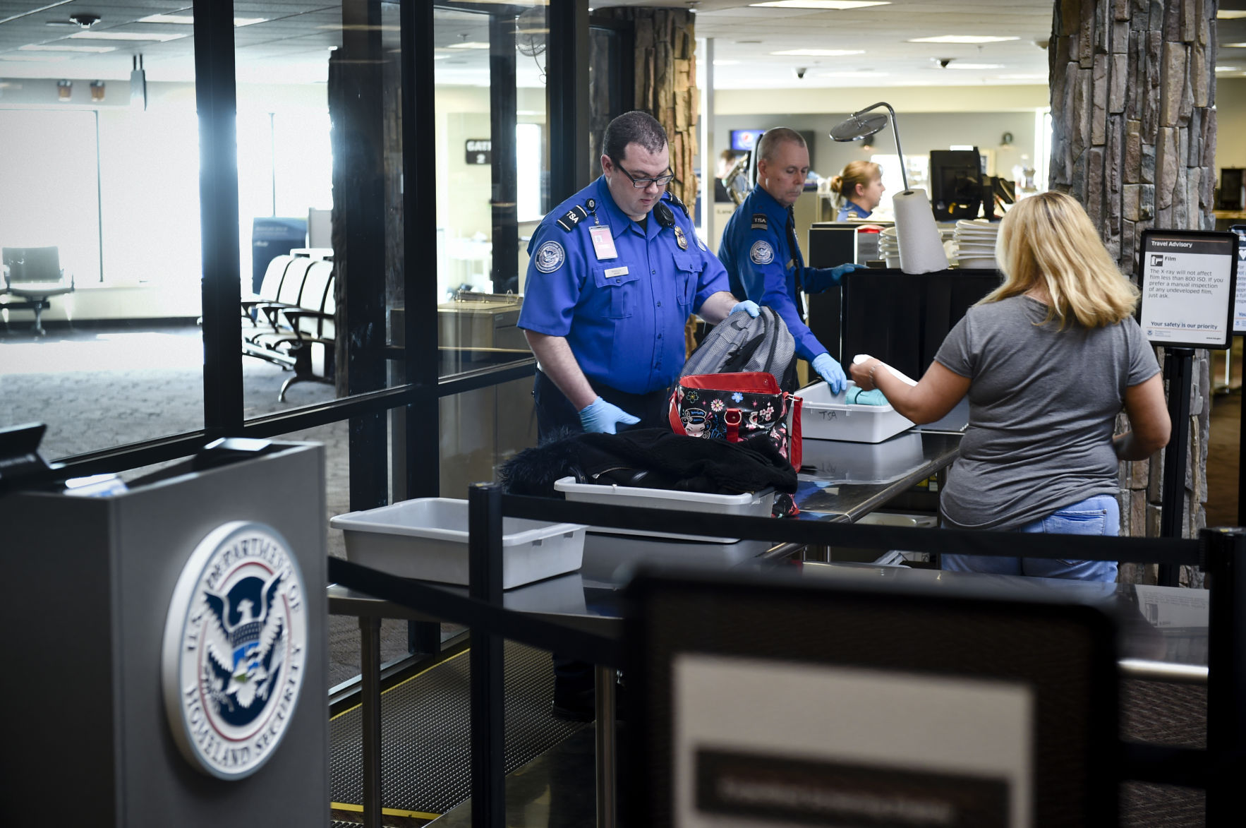 Passenger work through security recently at the Helena Regional Airport.